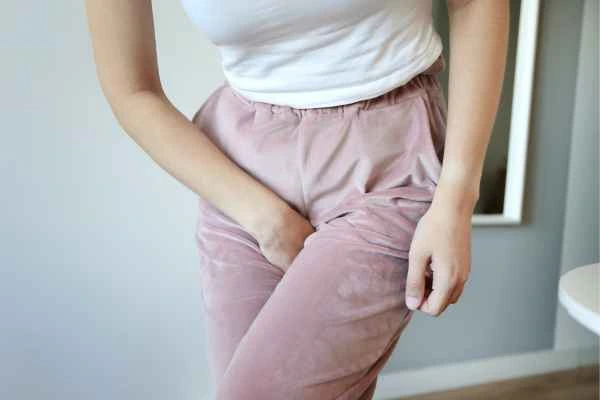 woman running for the toilet because of urinary incontinence Congleton
